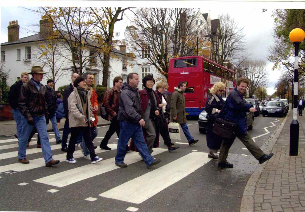 Beatles Fans crossing Abbey Road on a London Beatles Walking Tour